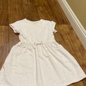 cream confetti sprinkled dress with bow and pockets